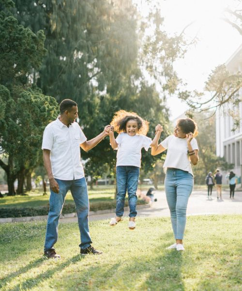 pexels-photo-1128317-1128317 Joyful family enjoying a playful day at the park, embracing love and togetherness under the summer sun.