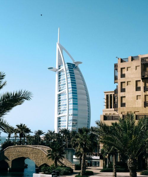 pexels-photo-12238284-12238284 Elegant capture of Burj Al Arab amid palms and canal in Dubai, UAE.