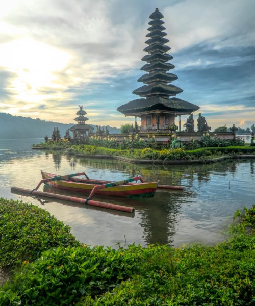 pexels-photo-2166559-2166559 Scenic view of Ulun Danu Beratan Temple with boats on Bratan Lake, Bali at dawn.
