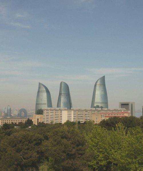 pexels-photo-32624845-32624845 Scenic panorama of Baku's iconic Flame Towers with urban skyline and lush greenery.